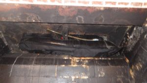 Gas line in damper area of solid fuel fireplace