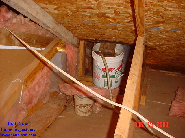 The chimney flashing leaked. The bucket worked well, until it filled up. The siphon hose didn't work very well. The sheetrock below the bucket was full of mold and needed to be replaced. I don't know what the Country Crock bowl was for.